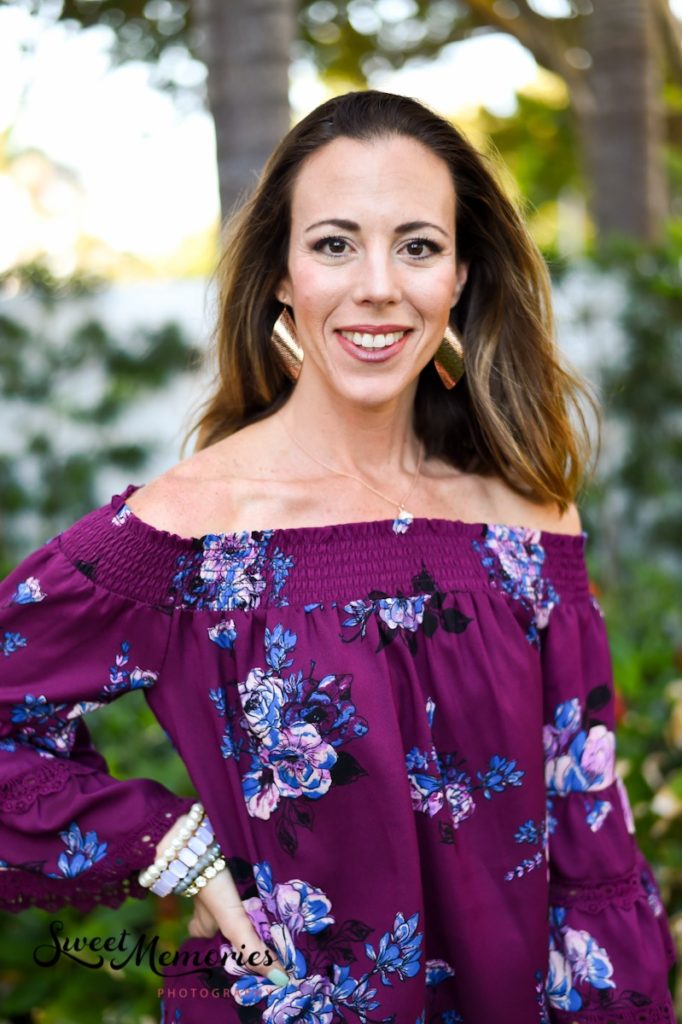 professional headshot photo outdoors with jewelry and floral print shirt